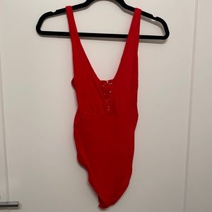 Red free people size small bodysuit with buttons - snap closure